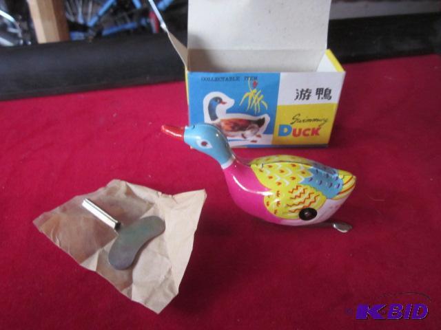 Vintage 1960s tin wind up swimming duck, new...