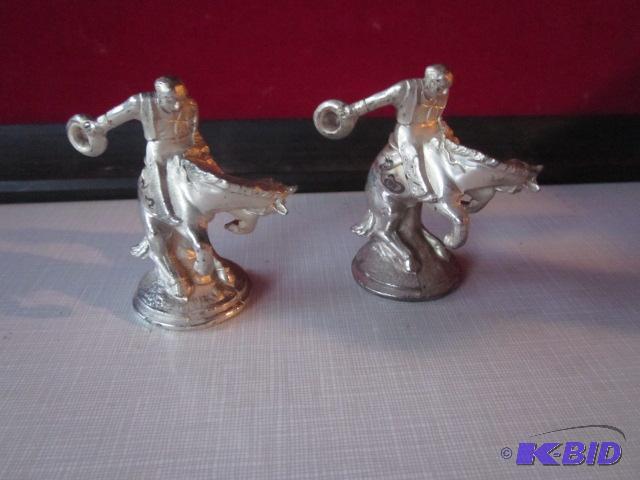 Pair of metal rodeo salt and pepper shakers.&...