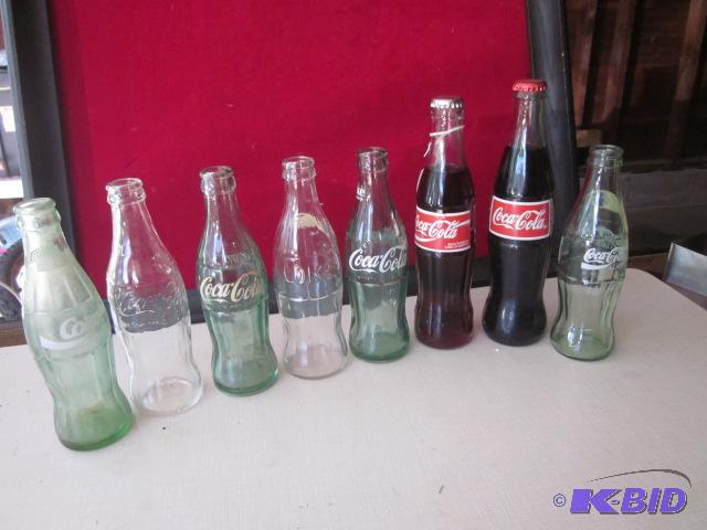 Lot of (9) vintage Coca Cola bottles, includi...
