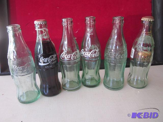 Lot of vintage Coca Cola bottles, some rare g...