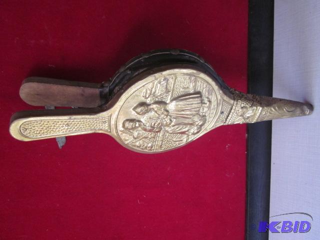 Antique bronze clad with embossed scene over ...