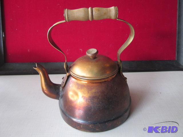 Copper kettle with wood handle....