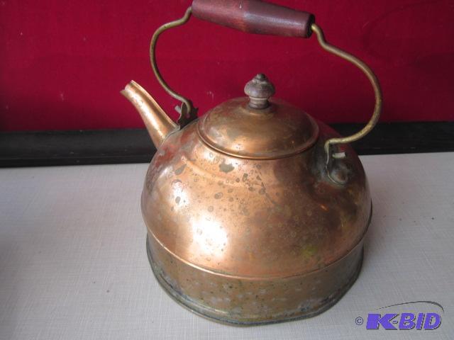 Copper kettle with wood handle.&nbsp...