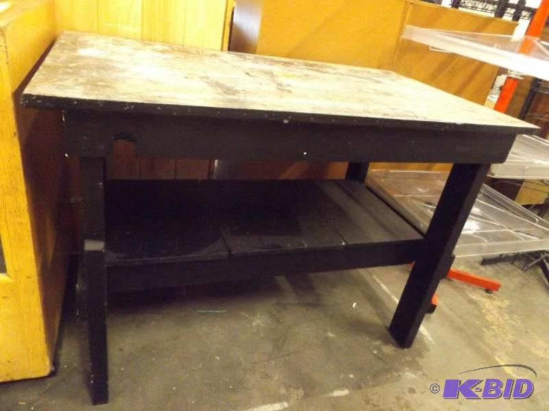 Black painted table or work surface, fairly w...