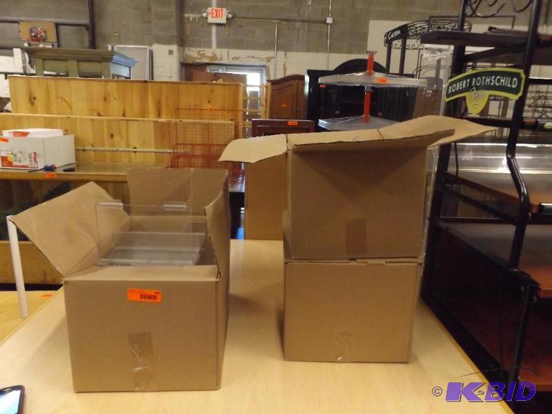 thre e boxes of plastic display caddies...