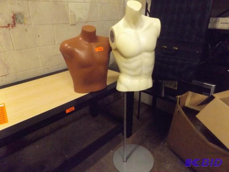 Two Mannequin busts. one is on a stand....