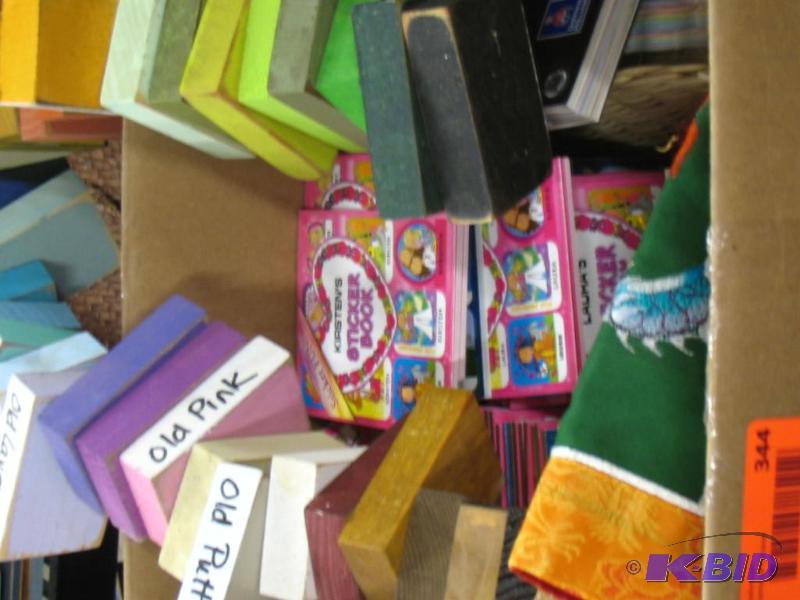 Box of paint and carpet samples, sticker book...