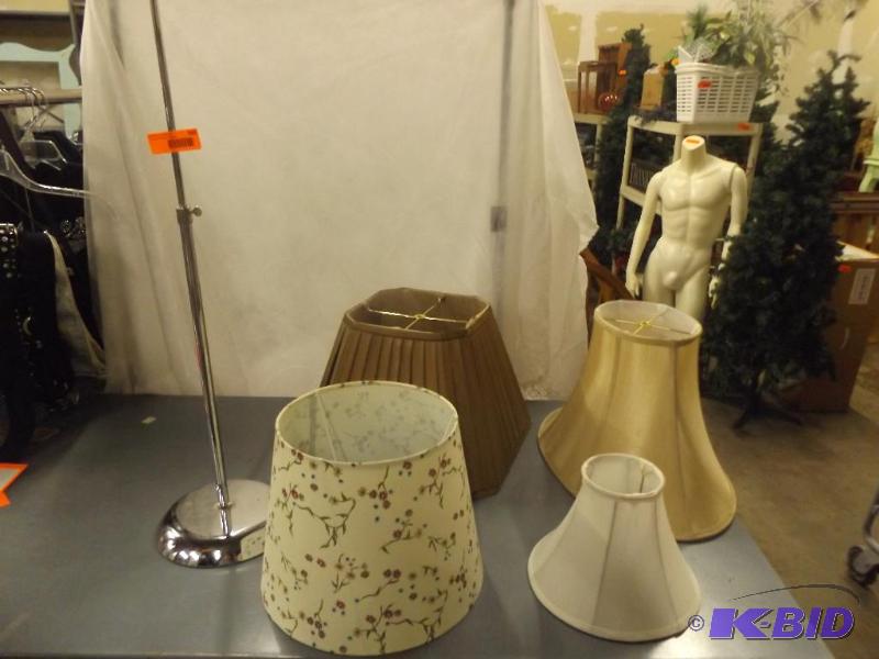 Four lamp shades and a metal stand...