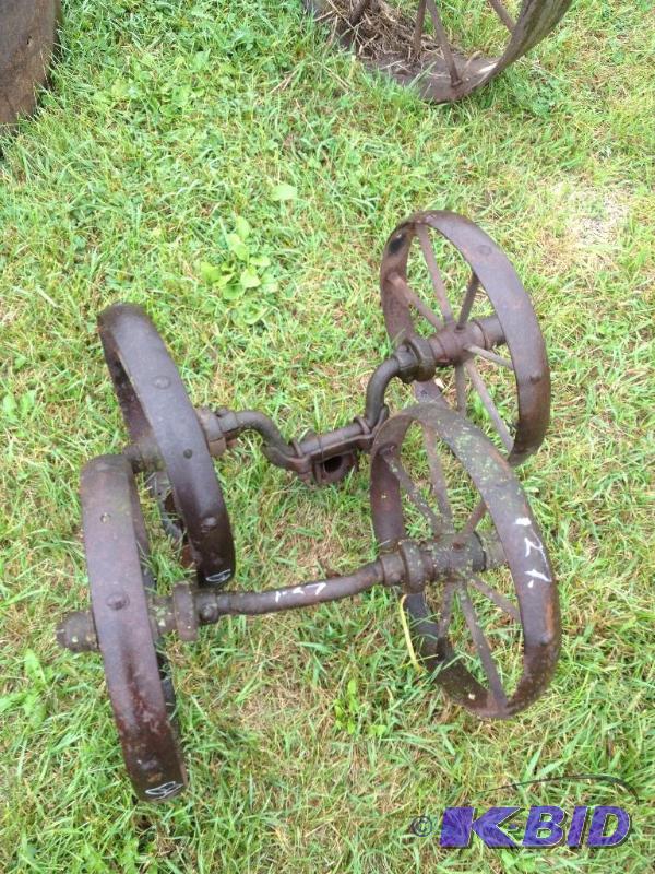 lot 127 image: Two sets of steel wheels on axles ...
