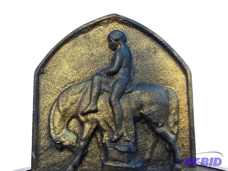 lot 13 image: Bookends with a indian on a horse motif