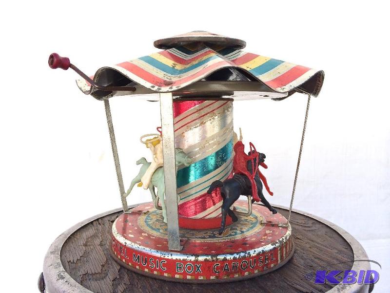 lot 16 image: Mattel Music Box Cow boy and Indian Merry go Round