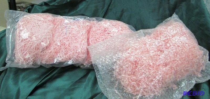 2 bags of pink paper ripped like grass...