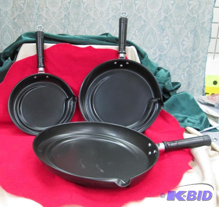 Set of 3 black pans has a easy way to drain o...