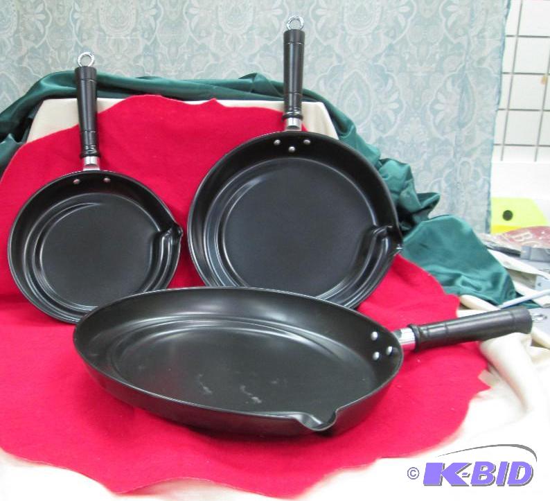 Set of 3 black pans has a easy way to drain o...