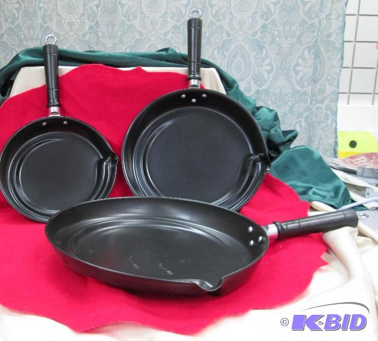 Set of 3 black pans has a easy way to drain o...