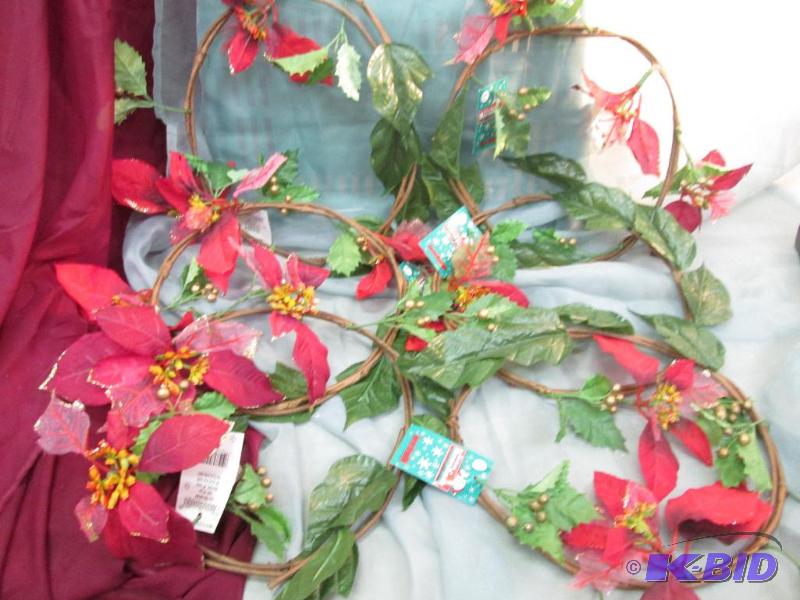 Round wreath with red flowers and gold berrie...