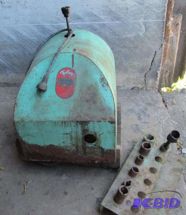 lot 3 image: Foley lawn mower blade sharpener with assorte...