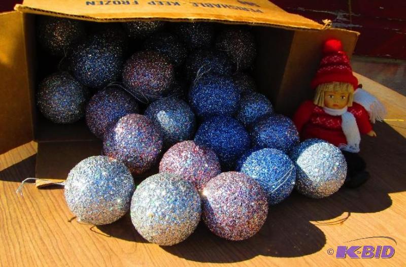 lot 59 image: Sparkly holiday balls and a girl with skiis d...