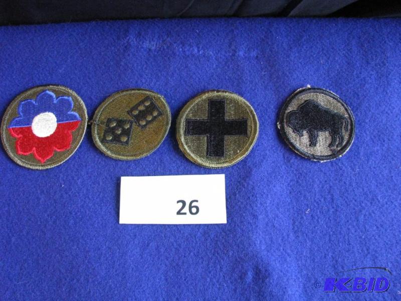 lot 26 image: 4 military patches. BDU unit crests. Unused...