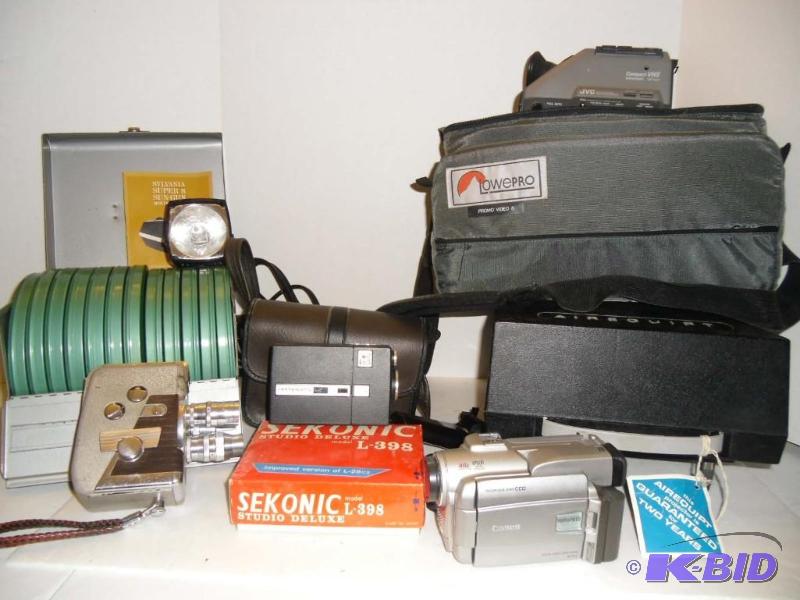 lot 20011 image: Lot of Movie Cameras Kodak, JVC, Revere  Airequipt Projector  16 mm film Reels in Case