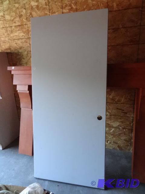 lot 56 image: 2 exterior doors used as temp doors for a rem...