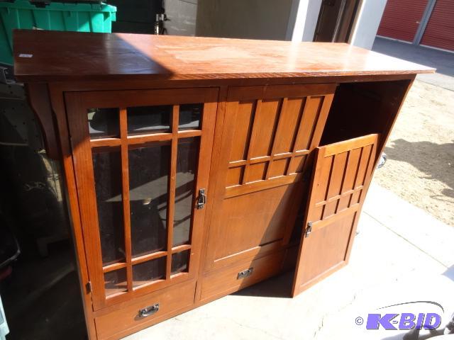 lot 75 image: Wood entertainment center cabinet. 68 x 23 x ...