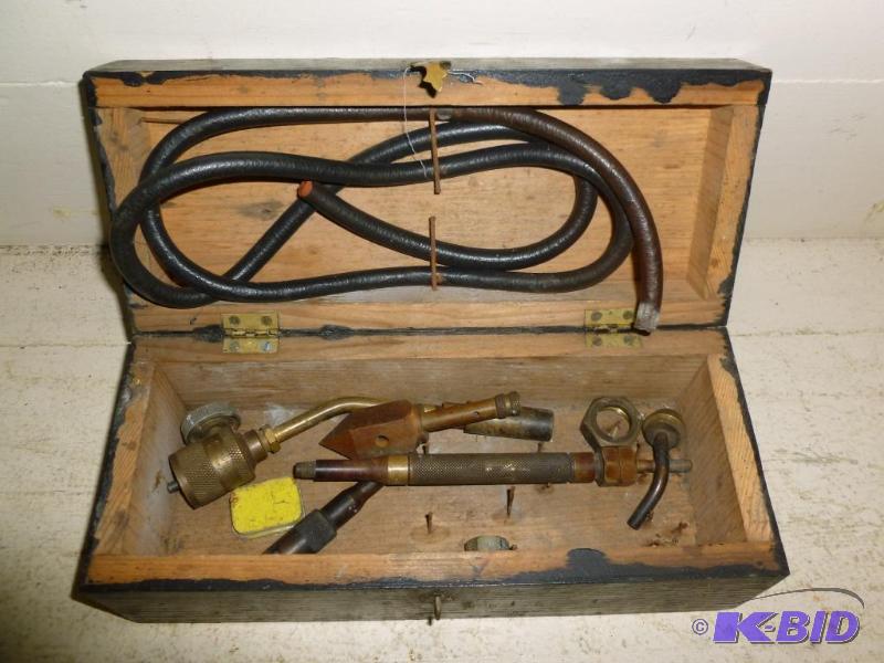 lot 157 image: Wooden flip lid box with brass torch accessor...