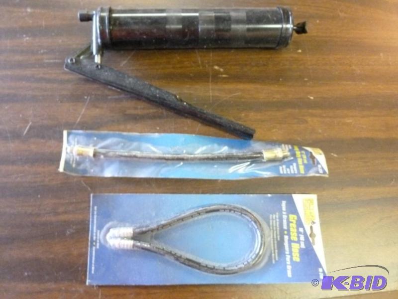 lot 23 image: Grease gun and two brand new Plews grease hos...