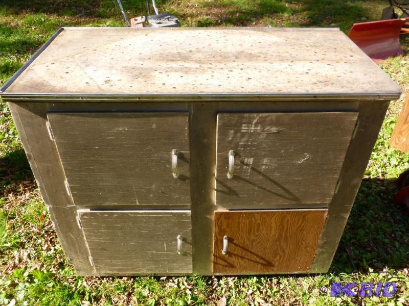 lot 36 image: Four door wooden shop cabinet that measures 2...