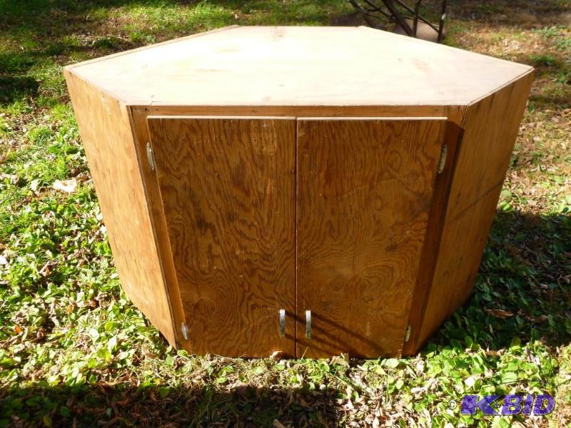 lot 37 image: Two door wooden corner shop cabinet that meas...