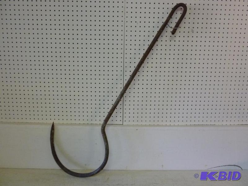 lot 56 image: Large iron meat hook that measures 46" ...