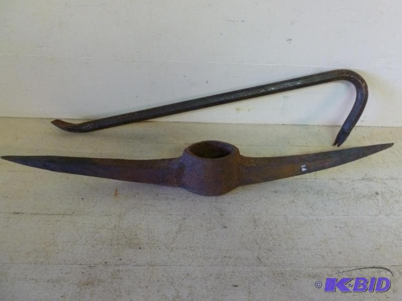 lot 70 image: This lot consists of a pick ax head and a lar...