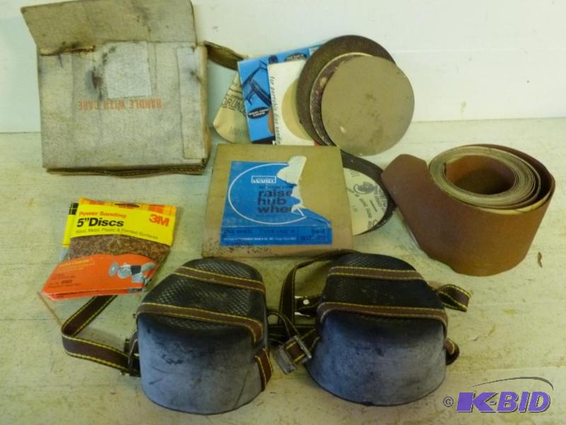 lot 83 image: Lot of new sandpaper and carpenter knee pads....