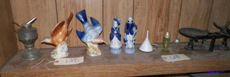 lot 128 image: Items shown on shelf.  Blue bird is repaired