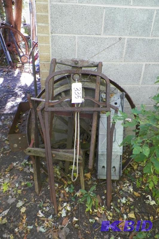 lot 335 image: Antique Cow Stanton, Old Sleds, Animal trap & Wheel