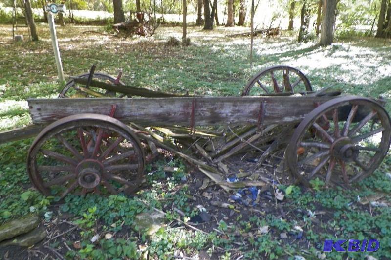 lot 343 image: Old Buggy Frame- Most or all of the metal parts should be there along with the wheels and axels.  This is as is and there will not be help to help with loading so plan accordingly