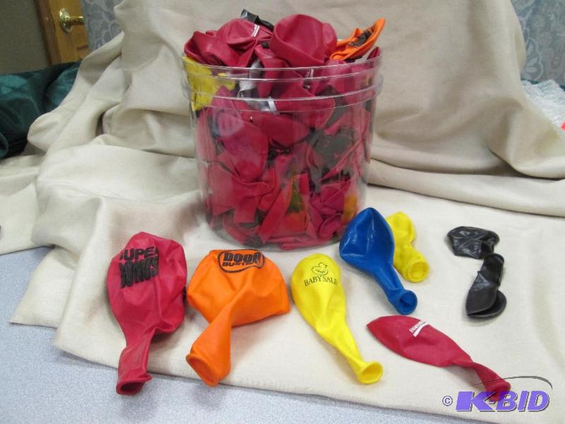 A container full of advertising balloons and ...