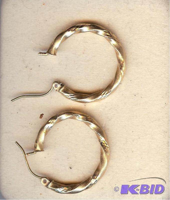 pair of 14 kt gold diamond cut hoop earrings ...