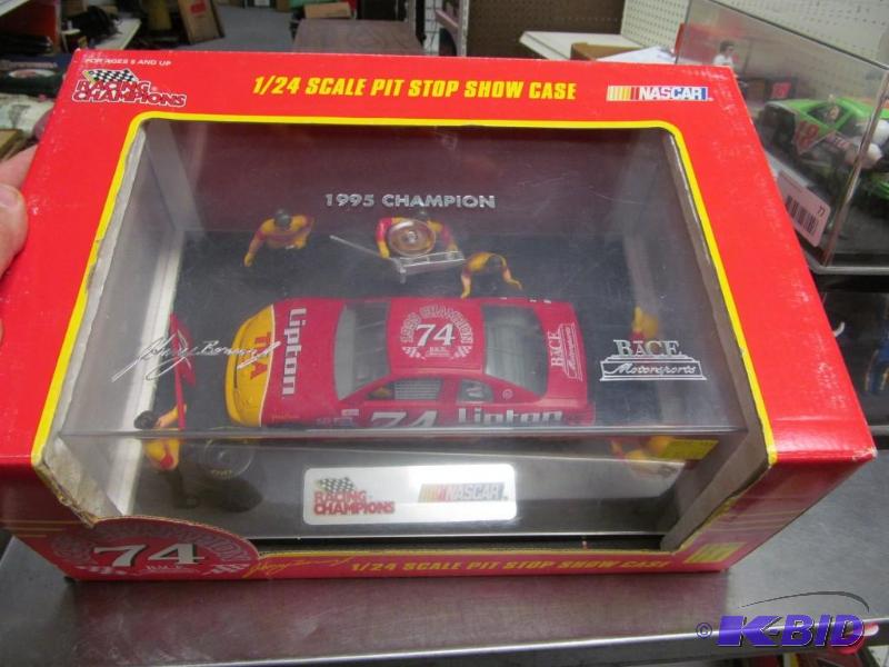 lot 76 image: 1995 #74 Johnny Benson Jr Lipton Ice Tea BACE Champion Pit Stop Show Case NASCAR 124 Die Cast Car by Racing Champions