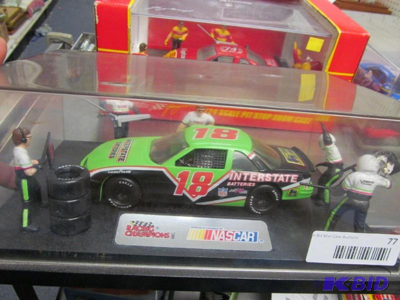 lot 77 image: 1995 #18 Dale Jerrett Interstate Batteries Pit Stop Show Case NASCAR 124 Die Cast Car by Racing Champions
