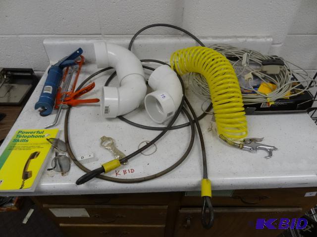 Contents of Top of Cabinet. 2 Caulking Guns. ...