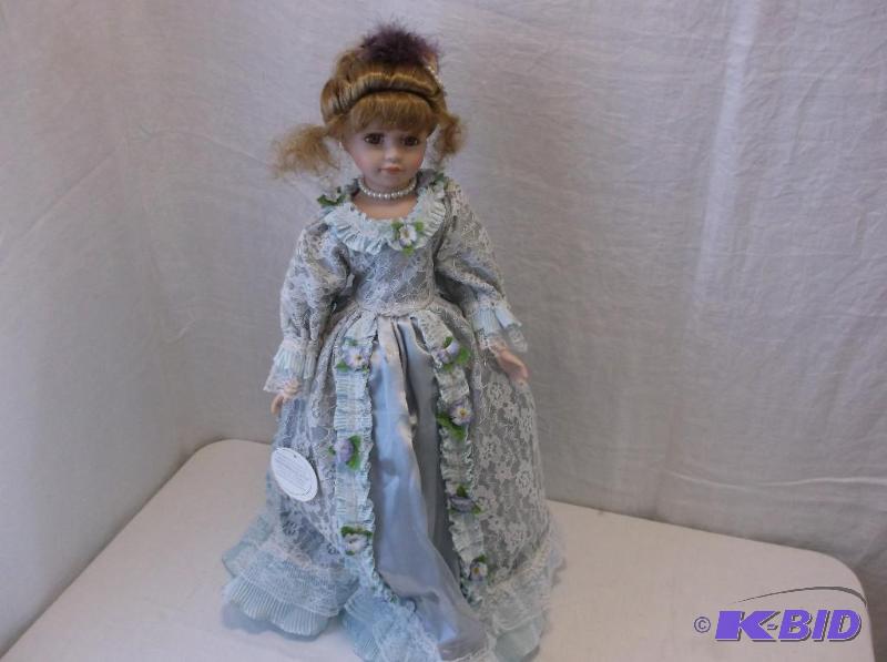 Beautiful porcelain doll measuring 22&quot T...