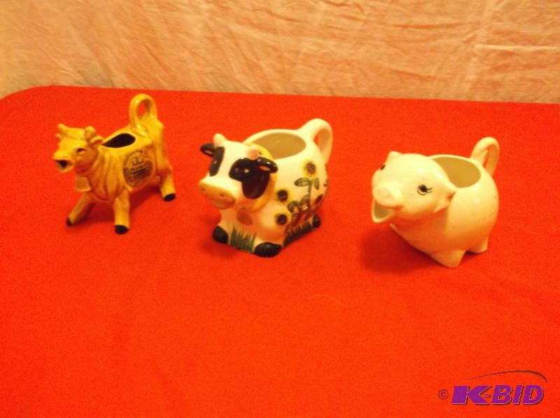 Collectable cow creamers one with advertiseme...