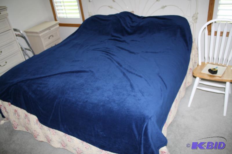 lot 18 image: Royal Blue Throw. It is shown here on a King ...