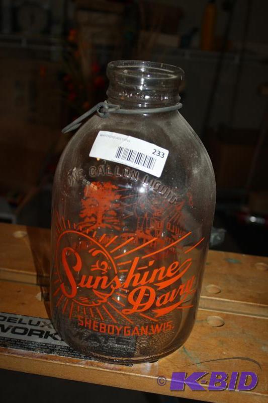 lot 233 image: Vintage gallon milk jug from Sunshine Dairy S...