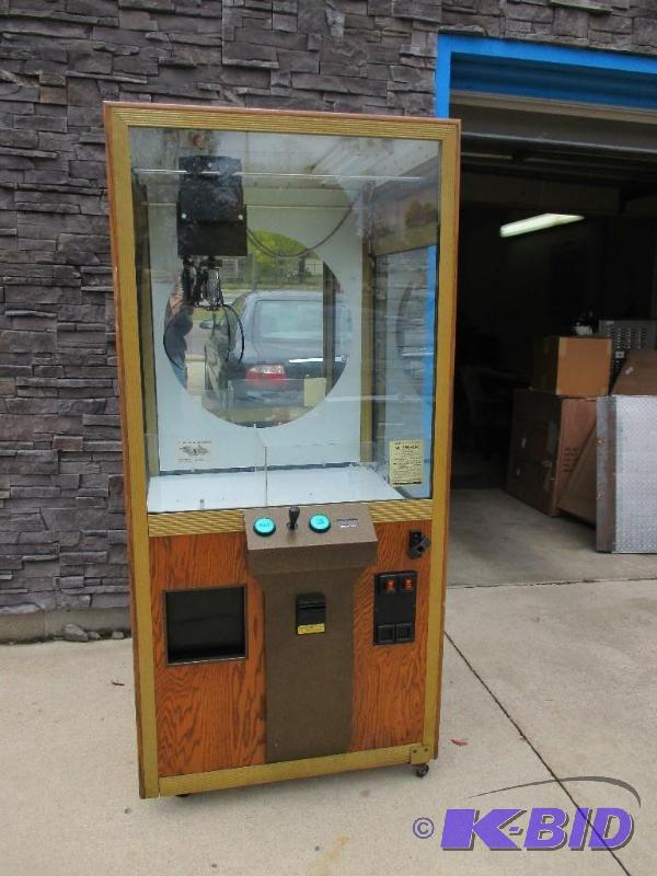 lot 12 image: Drop claw game, works, very heavy, bring appr...