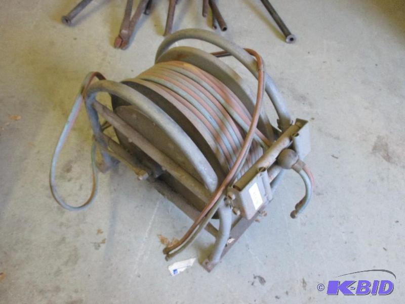 lot 81 image: torch hose and reel, approx 100, good condit...