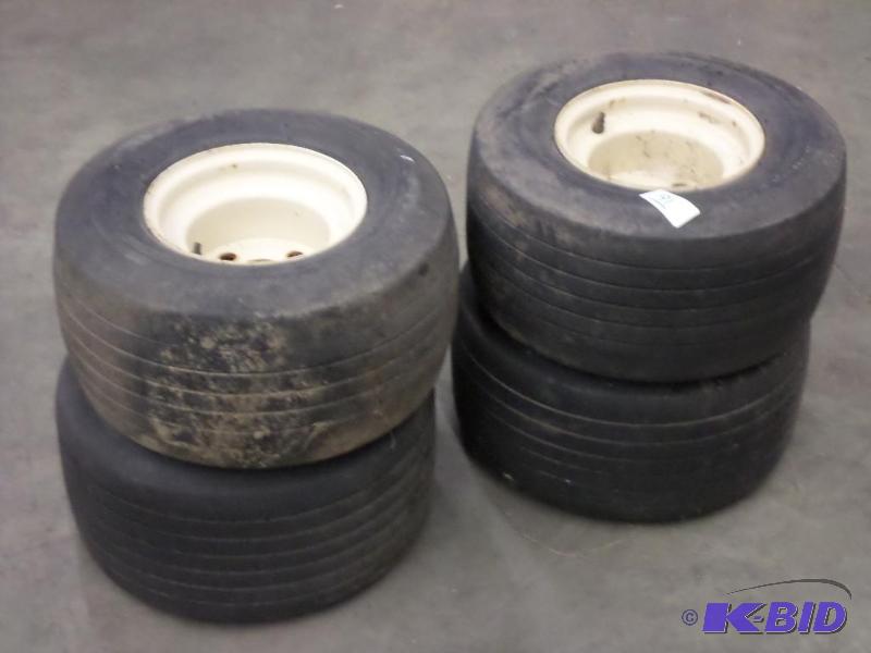 lot 91 image: (4) 4-Lug Golf Cart Wheels & Tires...
