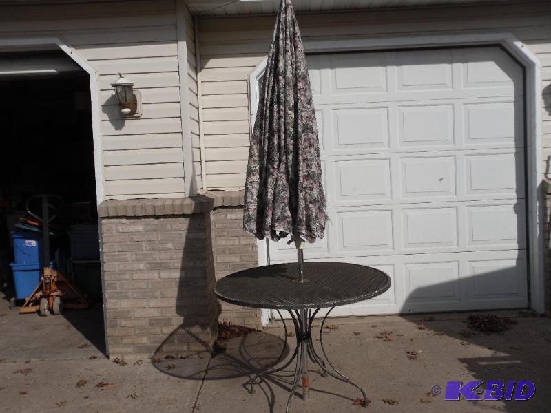 lot 120 image: Metal Outdoor Table with Umbrella. Table is a...