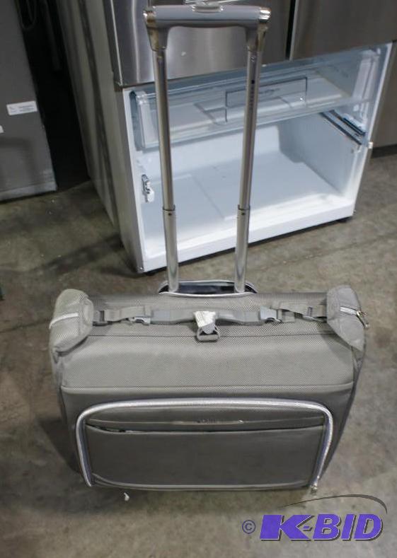 Delsey Travel Garment bag. Gray in color. Som...